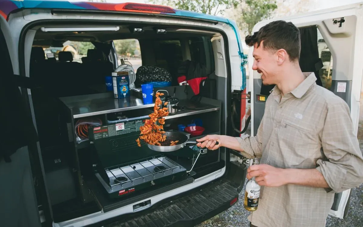Cooking in a campervan kitchen on the road