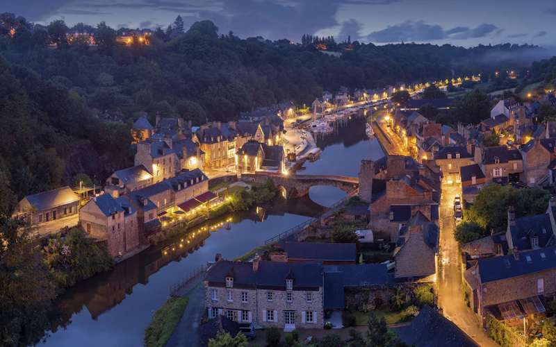 European village along a river at dusk
