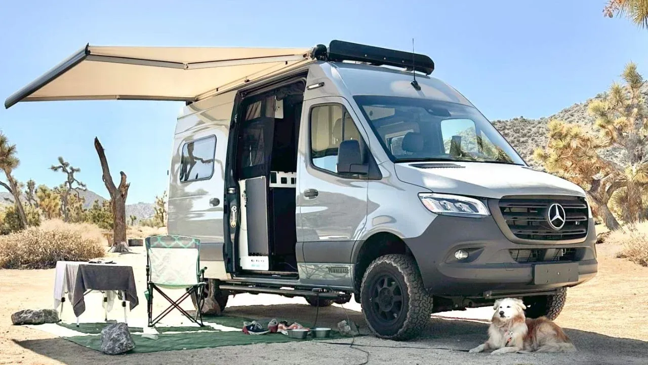Mercedes Sprinter campervan with awning set up in the desert