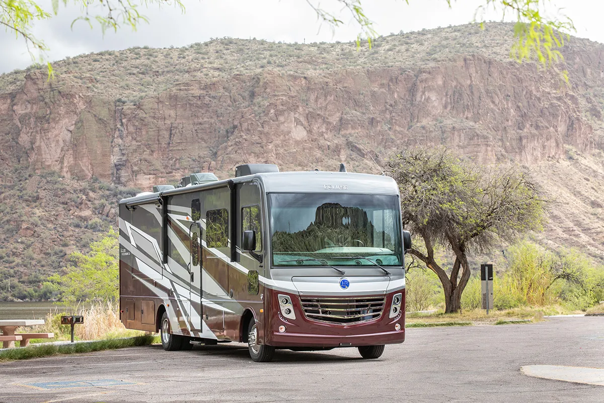Class A motorhome parked at a desert canyon campground